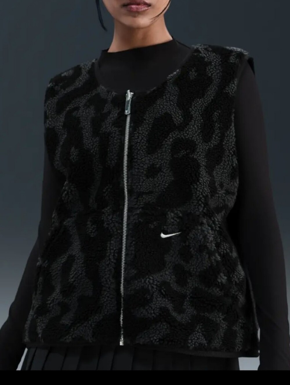 Nike Street reversible sherpa vest in black and leopard print